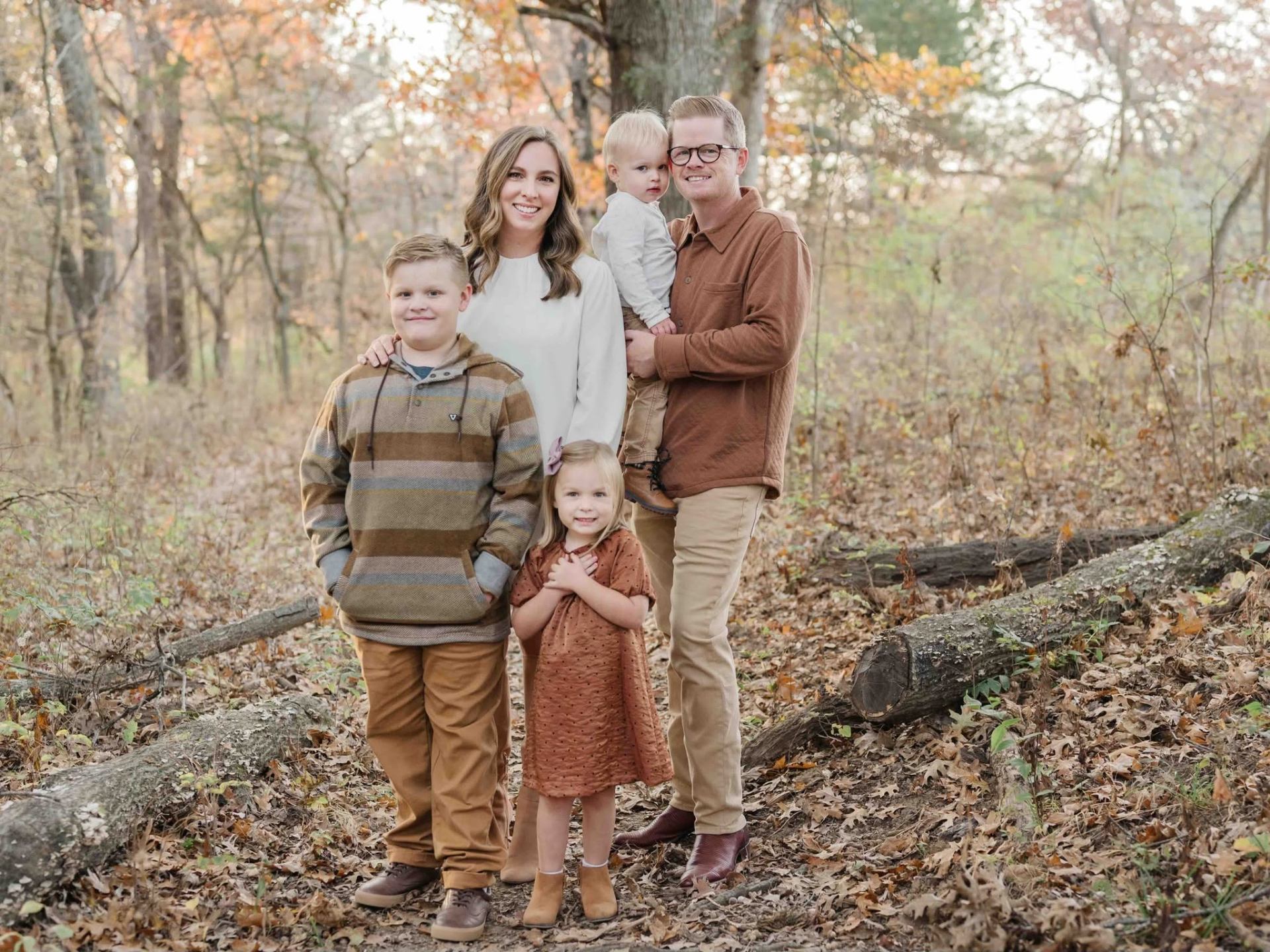 Caleb Rowden with his wife and children outdoors